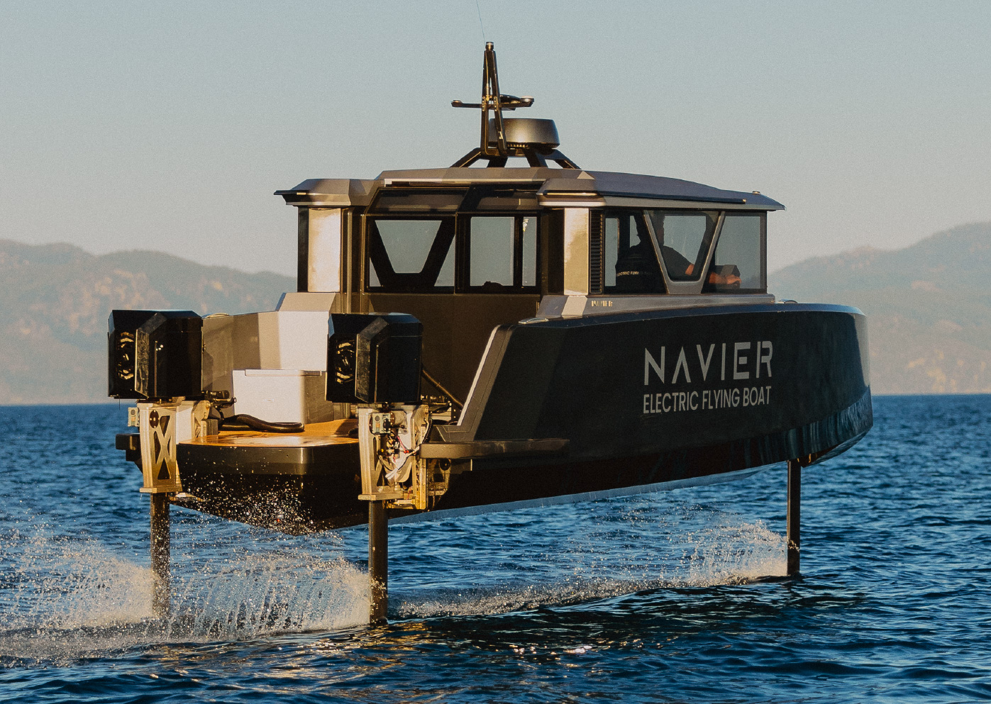 Navier electric flying boat on hydrofoils with NAVIER branding on the hull